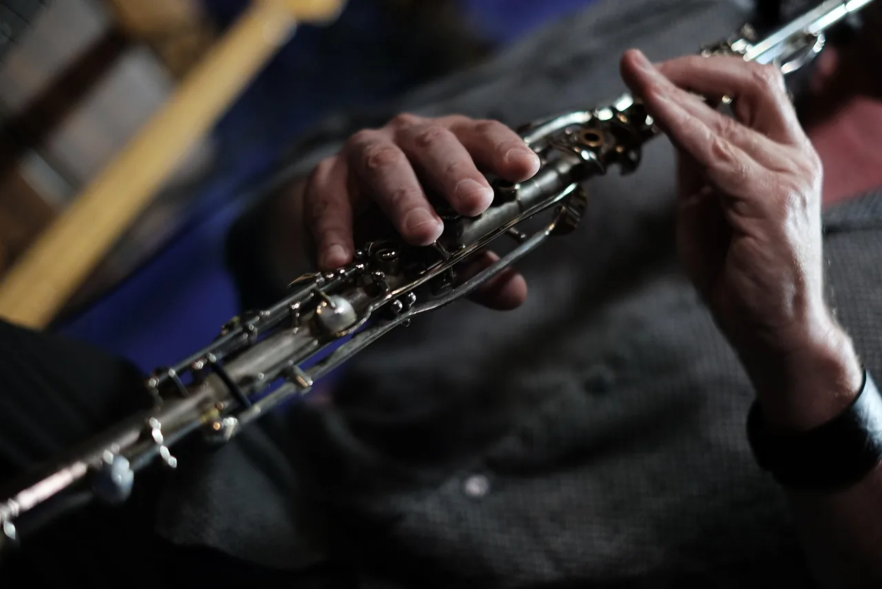 Musician’s hands on the keys of a clarinet