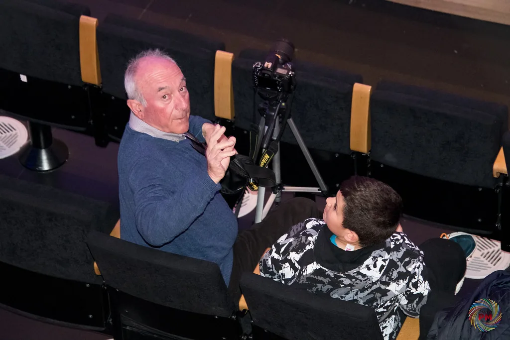 Photographer and child in a performance hall Photographer and child in a performance hall
