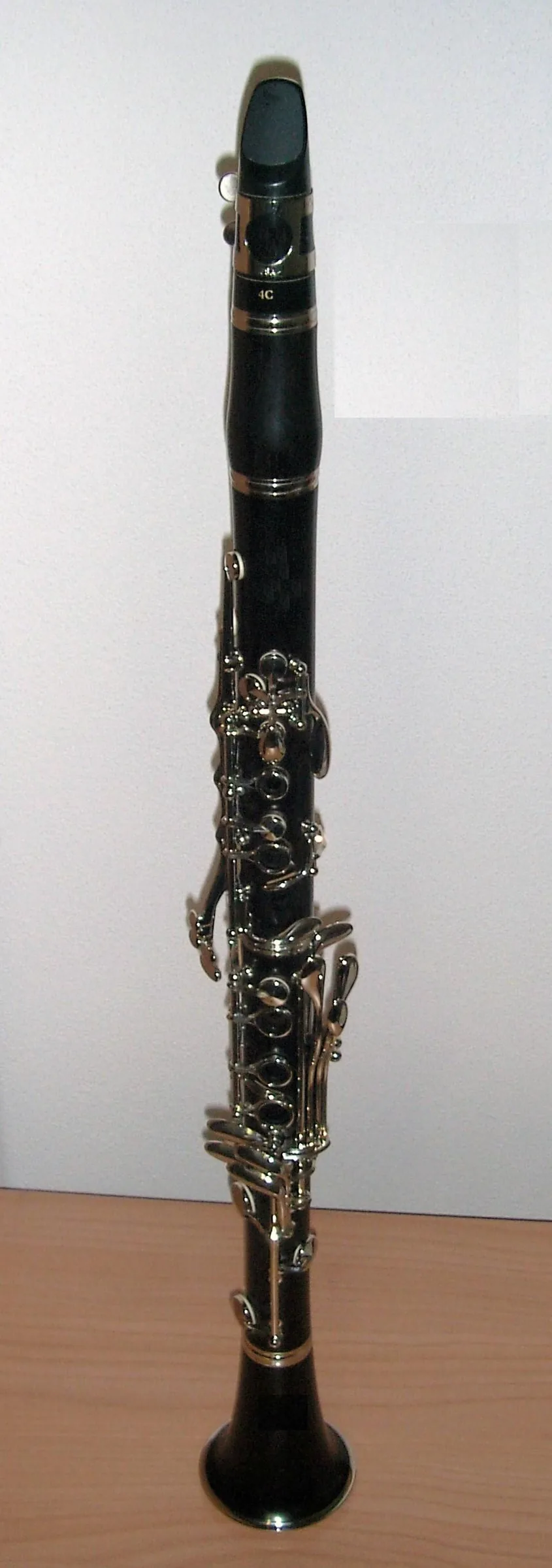 Black clarinet with silver keys on a table Black clarinet with silver keys on a table