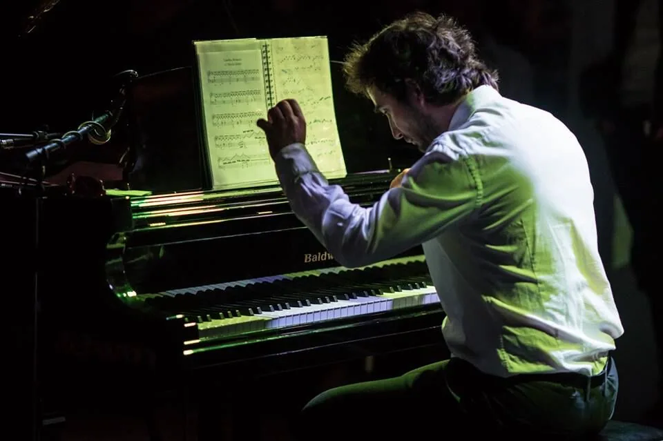Pianist at a piano with open sheet music Pianist at a piano with open sheet music