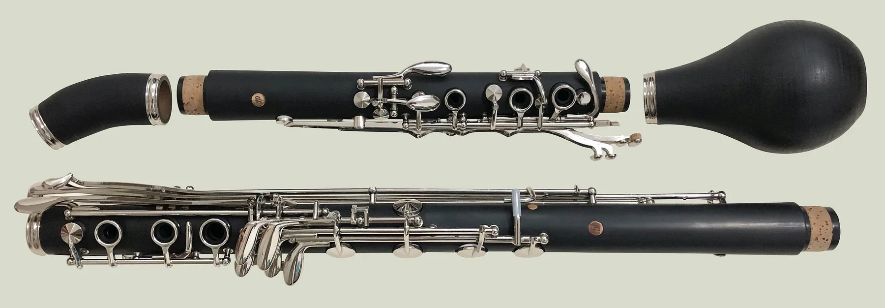 Disassembled clarinet and its silver keys Disassembled clarinet and its silver keys