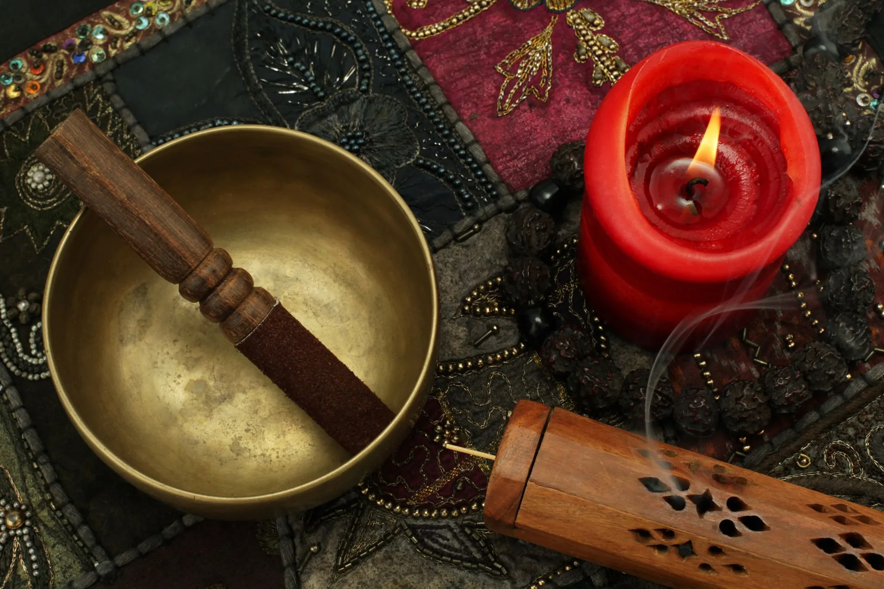 Tibetan bowl with mallet, candle, and incense Tibetan bowl with mallet, candle, and incense