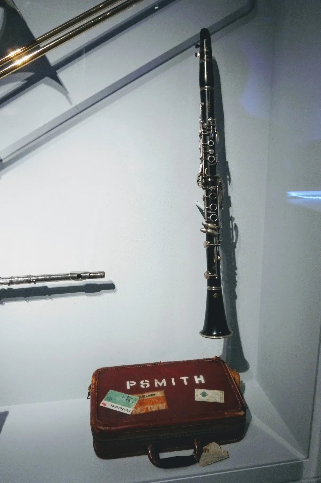 Black clarinet displayed with its antique case Black clarinet displayed with its antique case