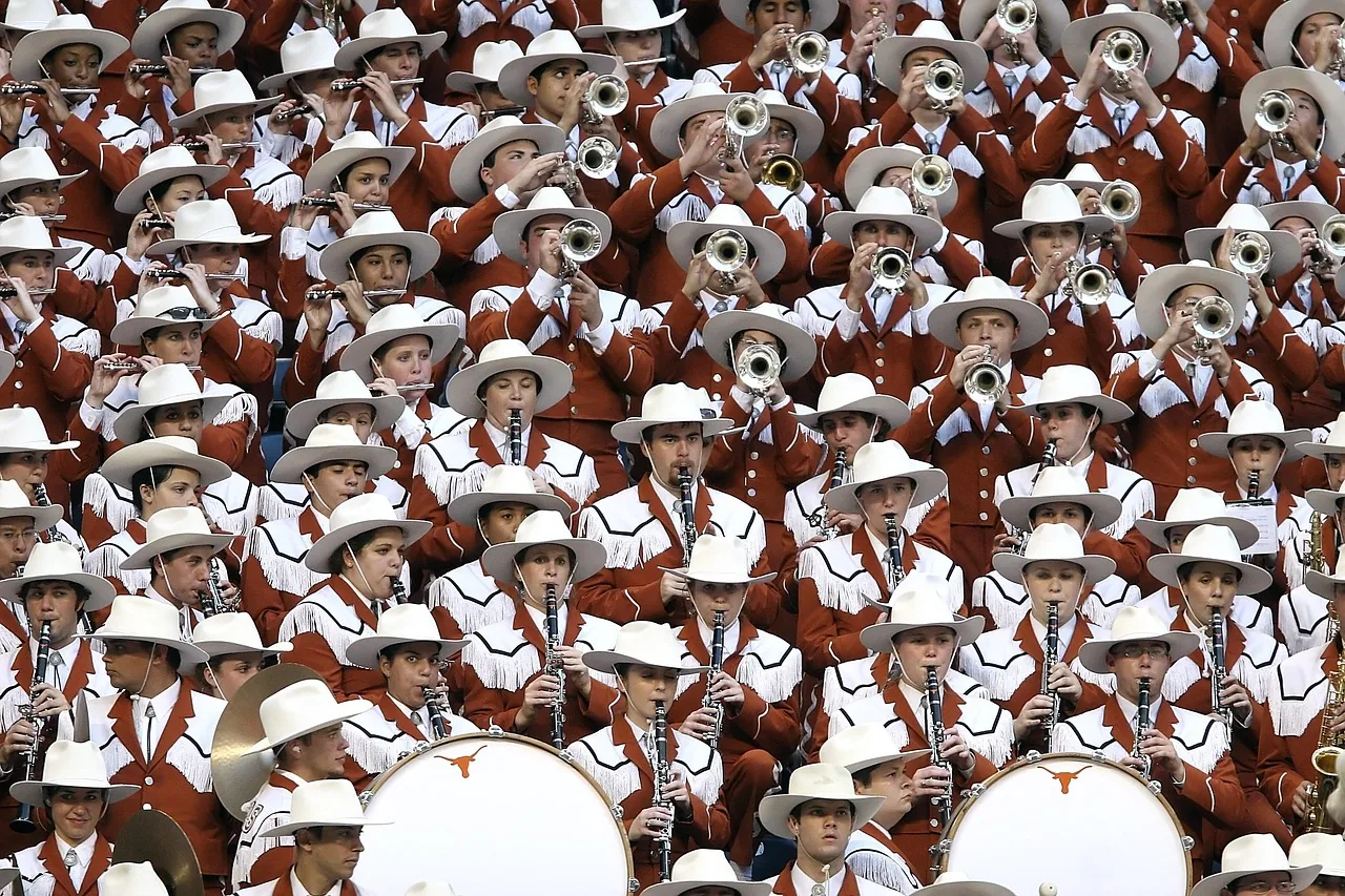 Clarinetists playing in a large marching band Clarinetists playing in a large marching band