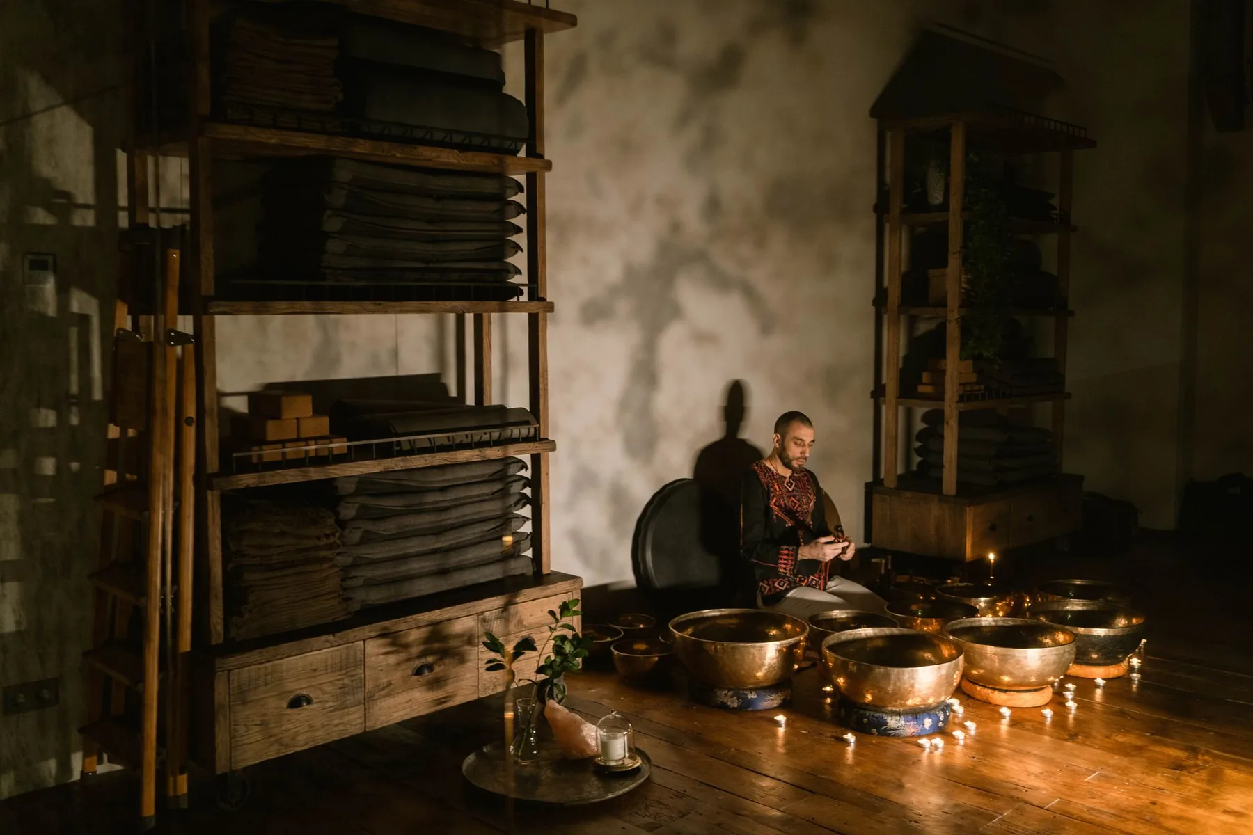 Musician surrounded by Tibetan singing bowls