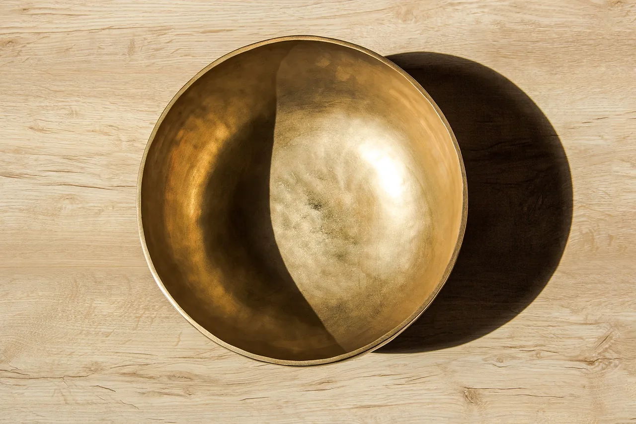Golden Tibetan singing bowl viewed from above Golden Tibetan singing bowl viewed from above