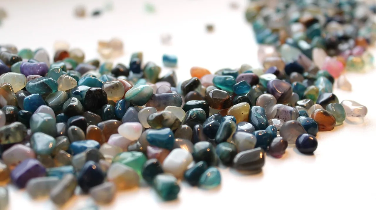 Multicolored polished stones on a white background Multicolored polished stones on a white background