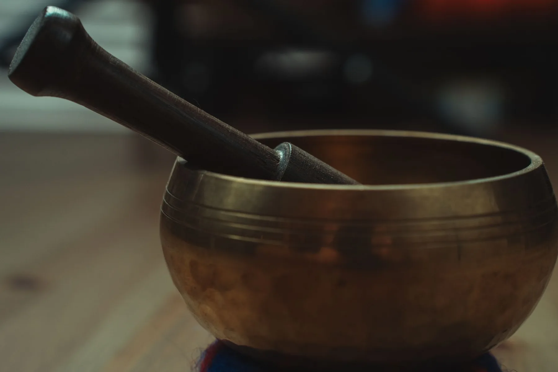 Tibetan singing bowl with its wooden mallet Tibetan singing bowl with its wooden mallet