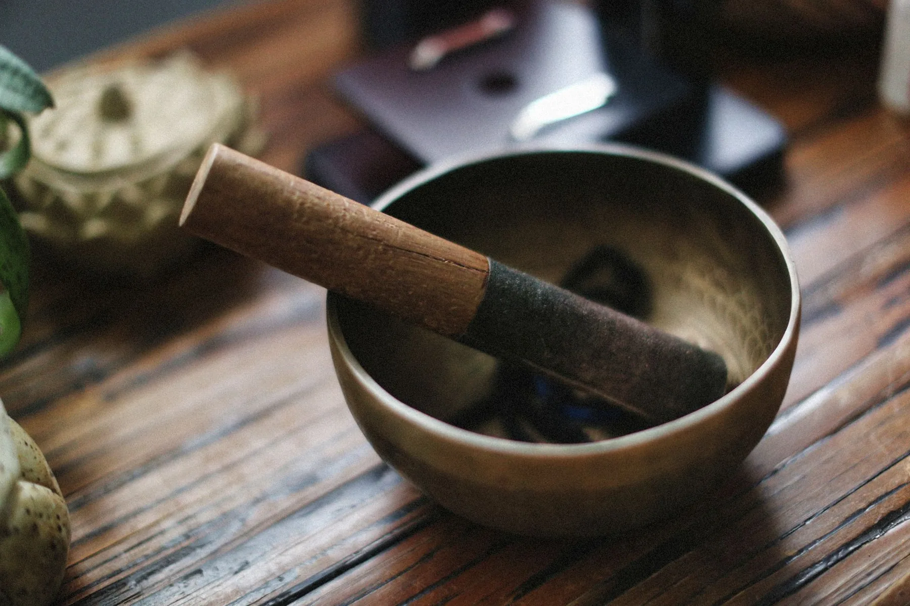 Metal Tibetan singing bowl with a wooden mallet Metal Tibetan singing bowl with a wooden mallet