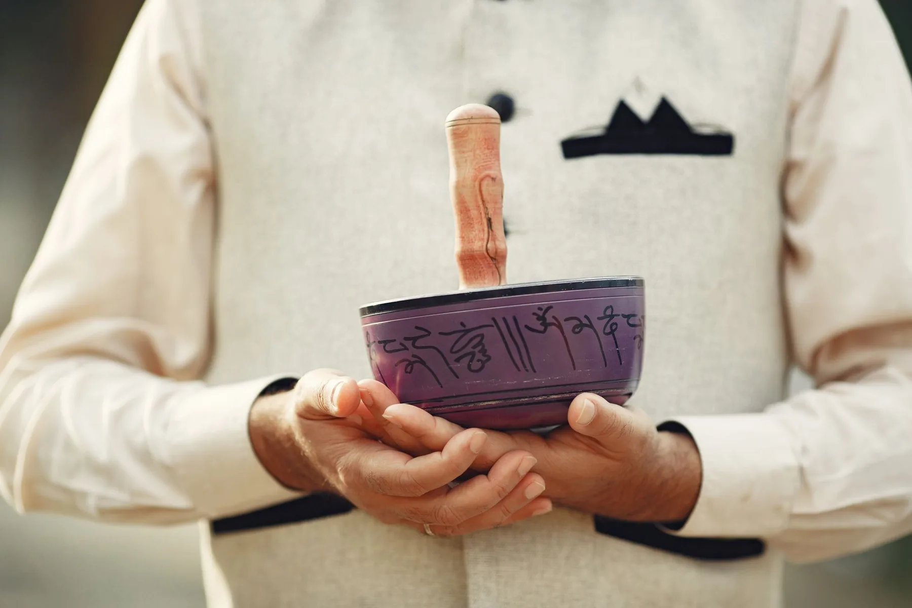 Tibetan singing bowl held in the hands Tibetan singing bowl held in the hands