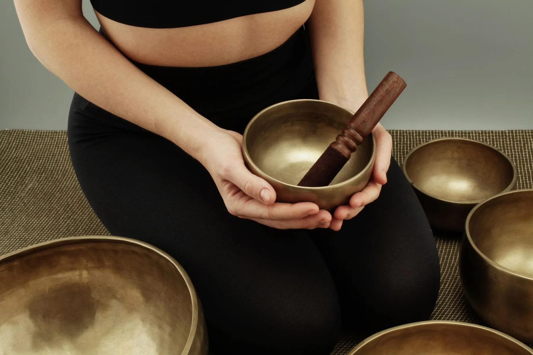 Tibetan singing bowl held with its mallet