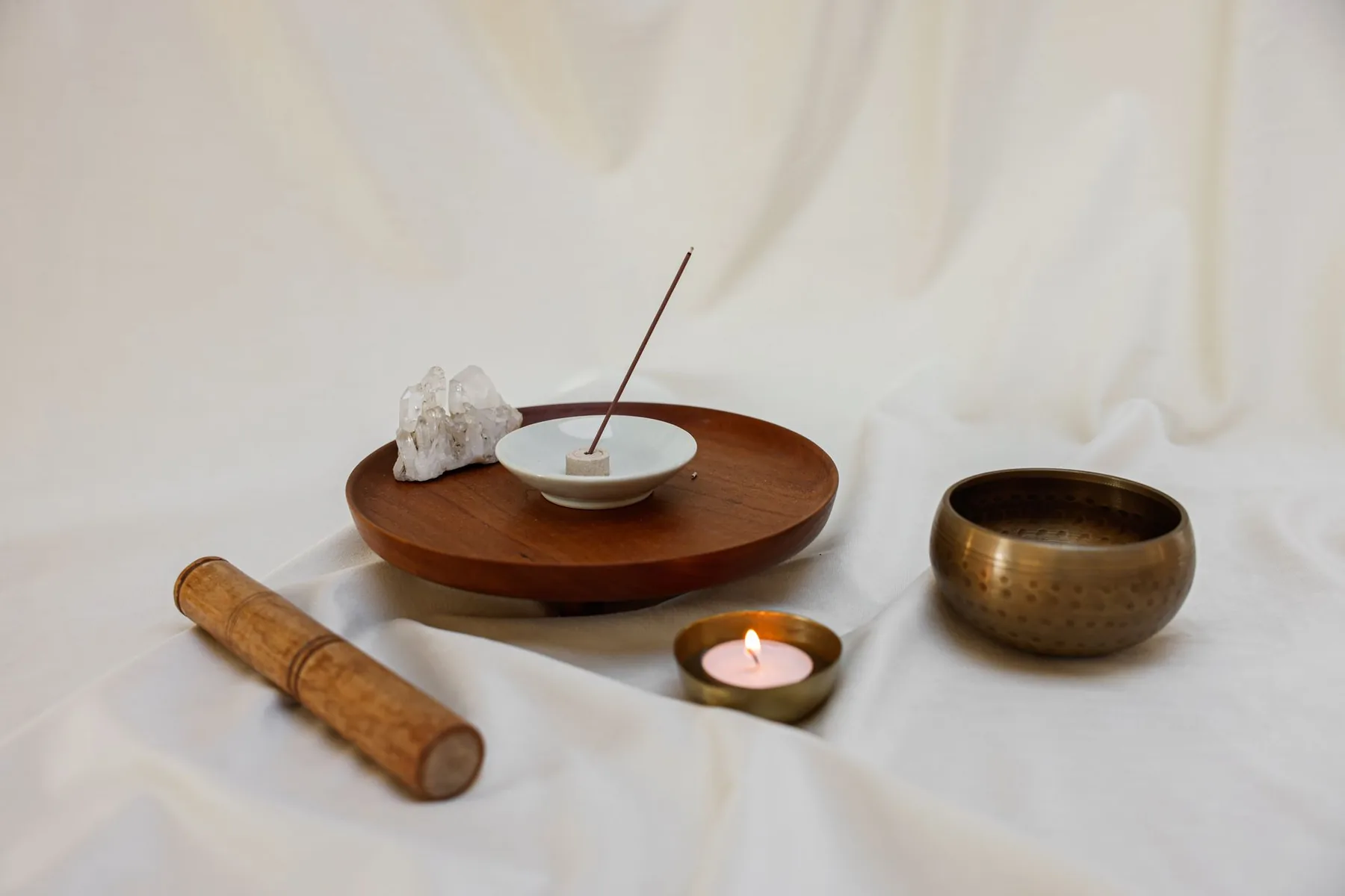 Tibetan singing bowl with a mallet, incense and a candle Tibetan singing bowl with a mallet, incense and a candle