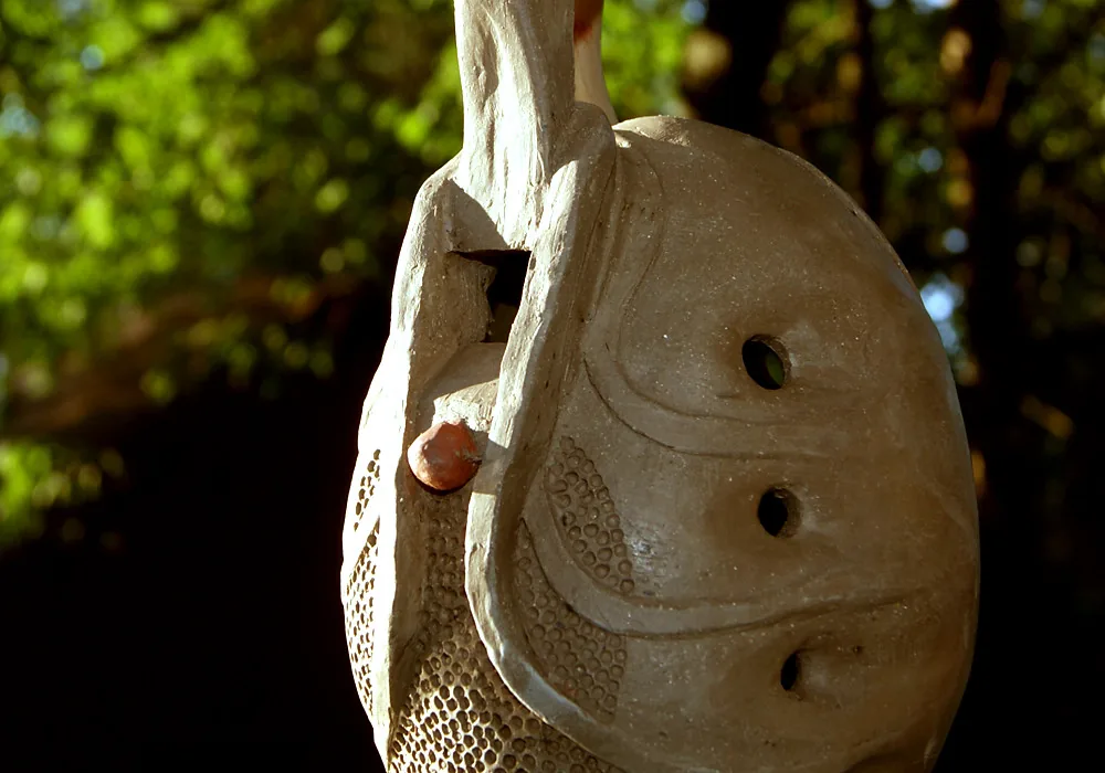 Close-up of a carved ceramic ocarina