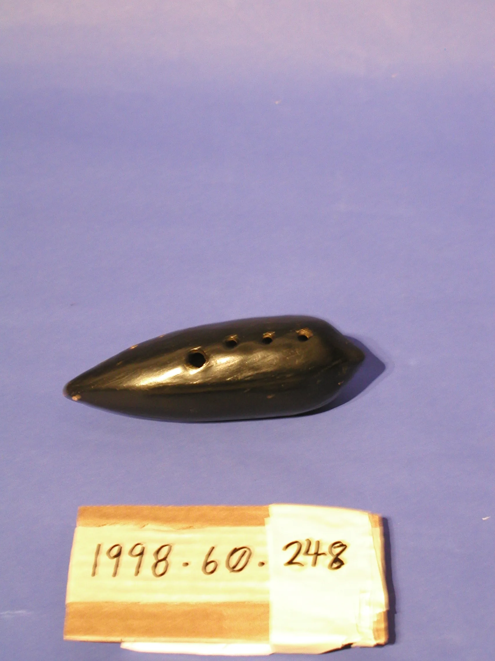 Dark ocarina displayed with an inventory label Dark ocarina displayed with an inventory label