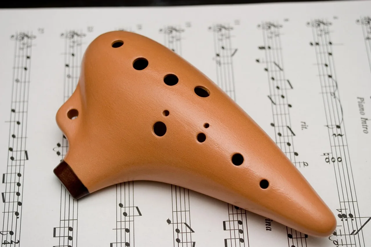Terracotta ocarina on sheet music Terracotta ocarina on sheet music