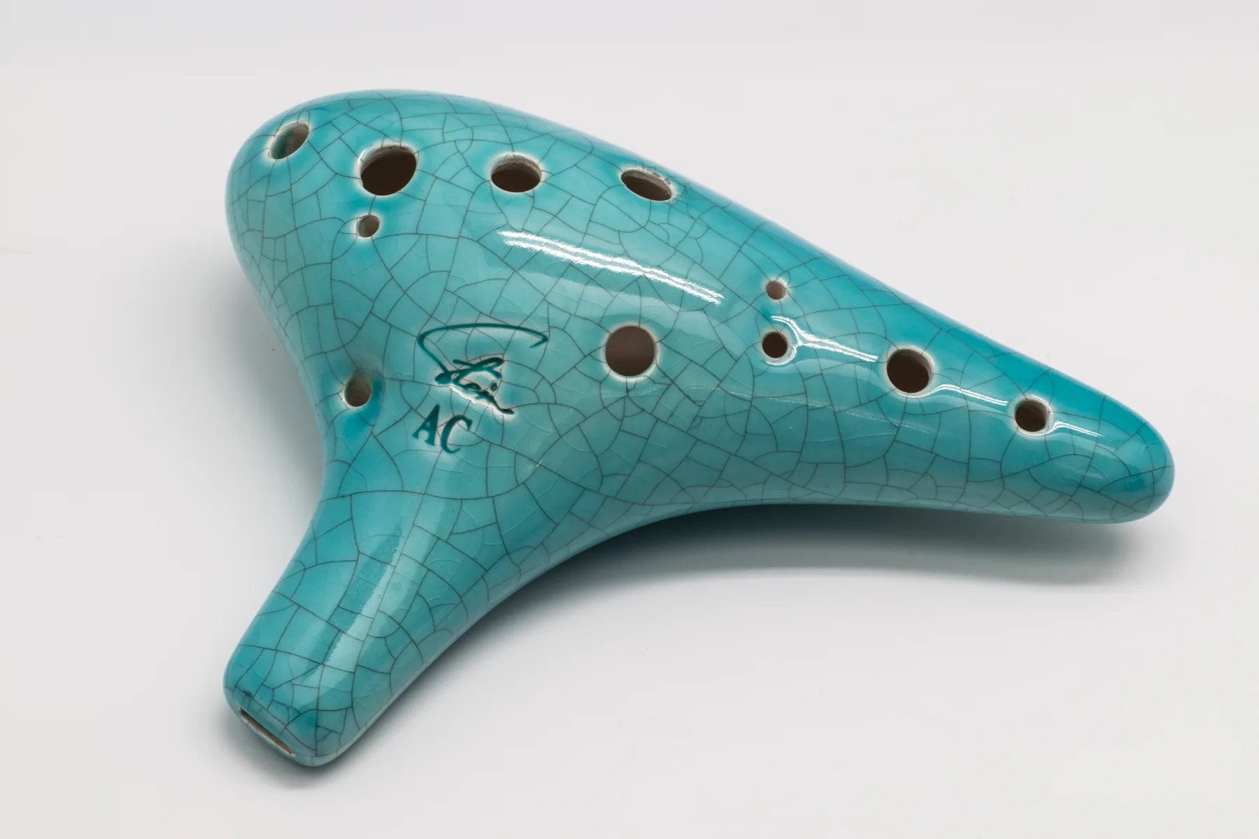 Turquoise ceramic ocarina with a crackle glaze Turquoise ceramic ocarina with a crackle glaze