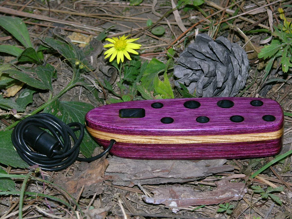 Purple wooden ocarina with cord